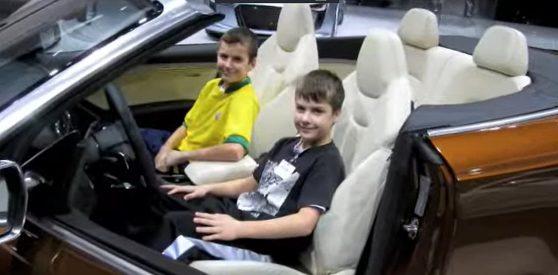 JP and Joe in a convertible at the 2010 Detroit auto show