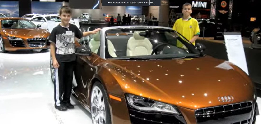A ten-year-old presenting an Audi R8 V10 Spyder