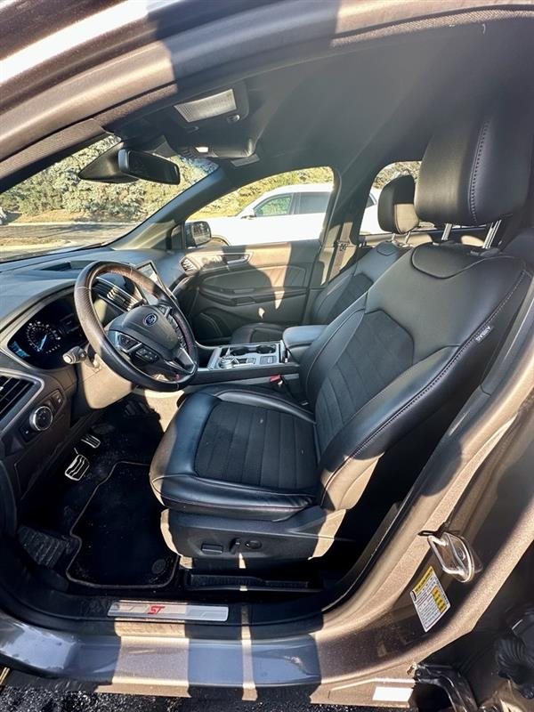 Front seats with red stitching and the ST doorsill