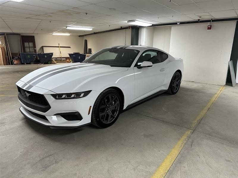 Front three-quarter of the Mustang in a parking garage