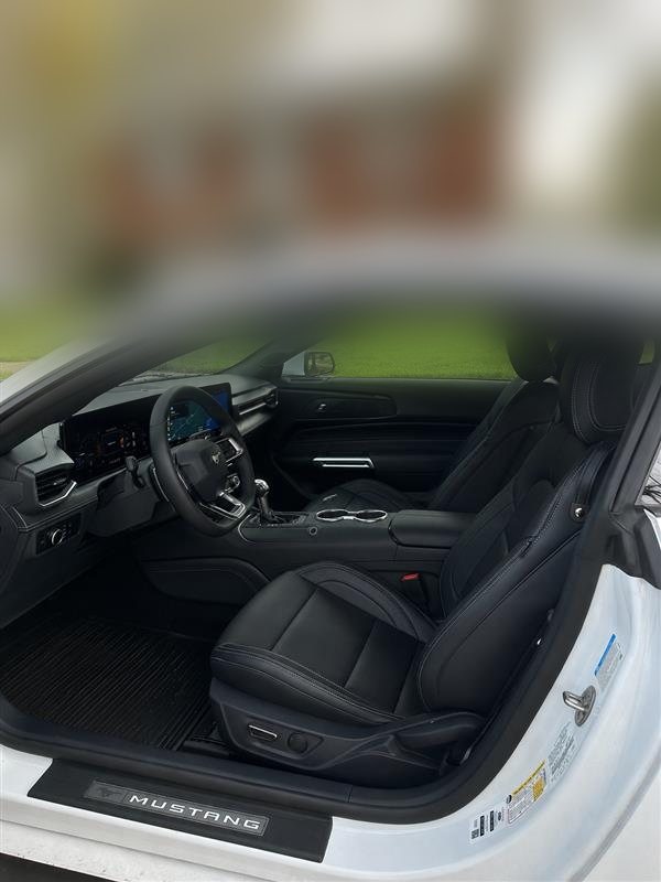 Mustang interior with black leather seats, paddle shifters and digital dash