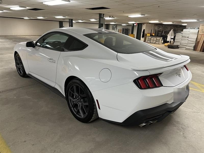 Rear three-quarter of the Mustang in a parking garage